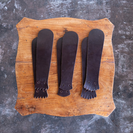 Brown CXL Kiltie variety mix on a wooden table.