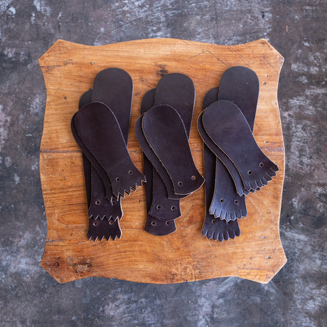 Brown CXL Kiltie variety mix on a wooden table.
