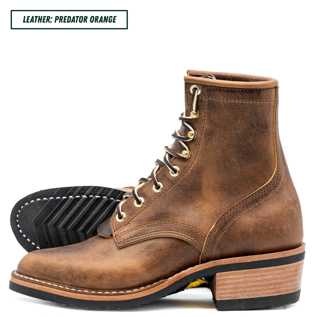 A brown distressed leather lace-up ankle boot with a stacked wood-look heel, black sole, and gold-tone eyelets. A second boot is shown from the tread side in the background. Top left reads 'LEATHER: PREDATOR ORANGE'