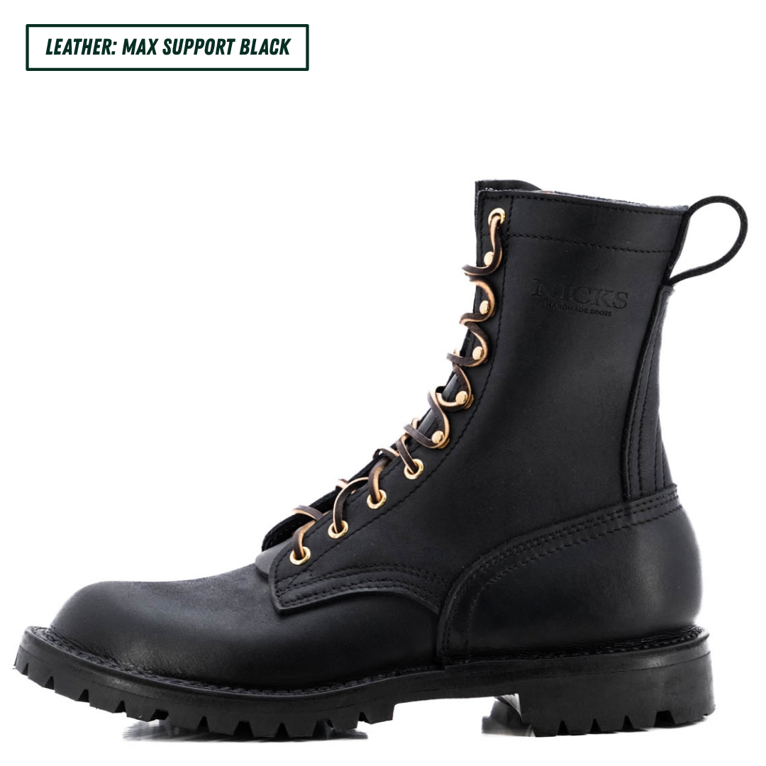 A pair of black leather lace-up combat boots with gold-tone eyelets and a rugged sole, shown on a white background with a text label in the top left corner.