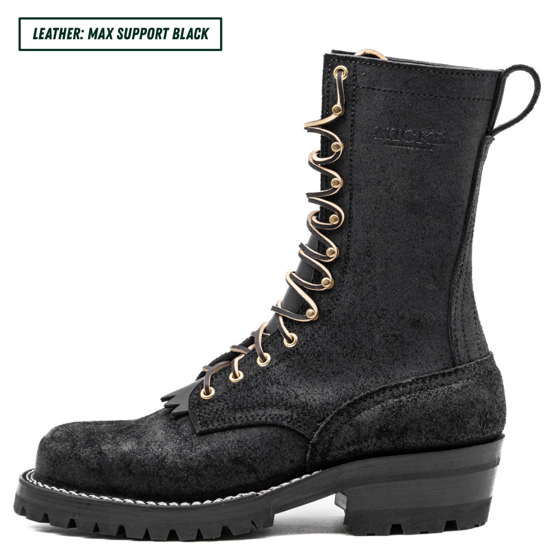 A black leather lace-up boot with gold-tone metal eyelets and laces, shown from a side profile on a white background. A text label in the top-left corner reads 'LEATHER: MAX SUPPORT BLACK'.
