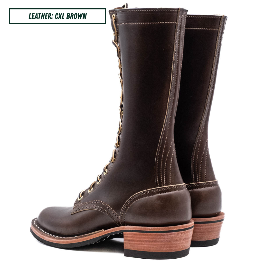 A pair of dark brown leather lace-up boots shown from the side and back on a white background, with a text label in the top-left corner reading 'LEATHER: CXL BROWN'.