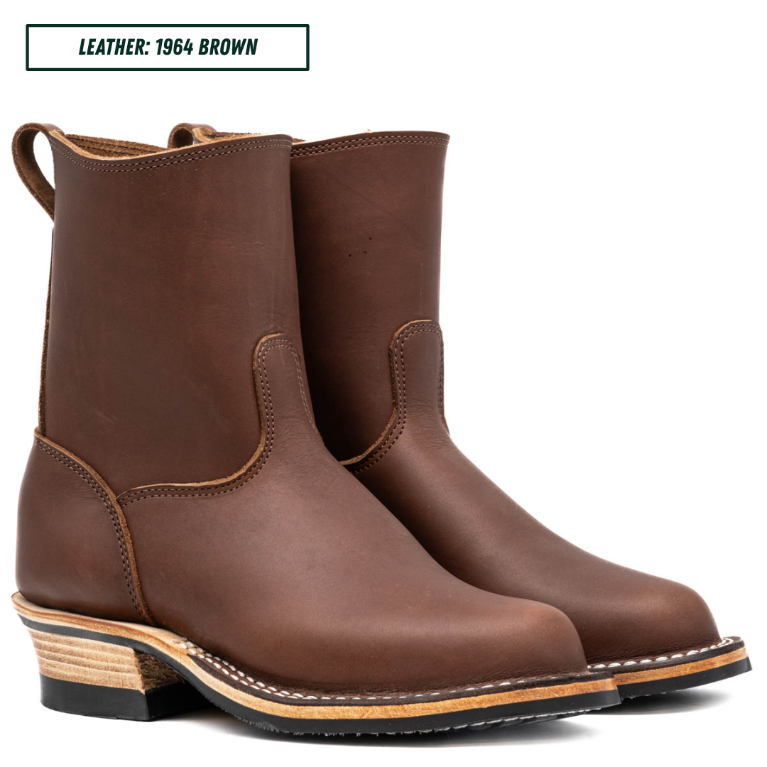 A pair of brown leather mid-calf boots with stacked wood-look heels, shown on a white background with a text label in the top-left corner reading 'LEATHER: 1964 BROWN'.