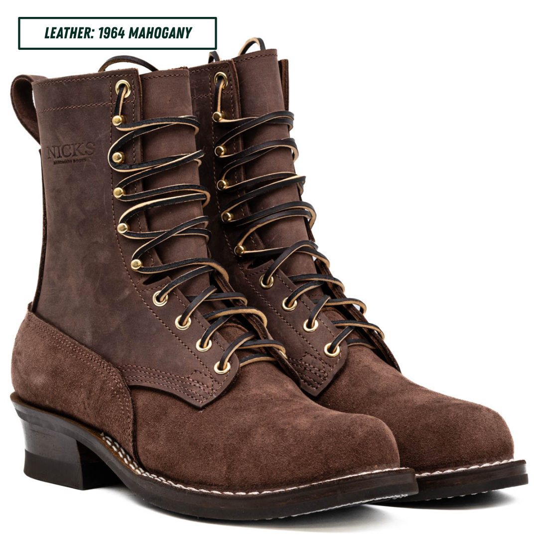 A pair of dark brown leather lace-up boots with gold-toned metal eyelets and laces, shown on a white background with a text label reading 'LEATHER: 1964 MAHOGANY'.