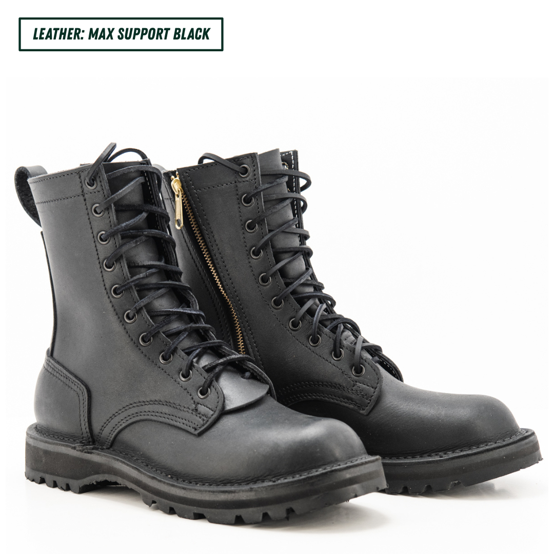 A pair of black leather lace-up combat boots with side zippers and a gold zipper pull, shown on a white background with a text label in the top left corner.
