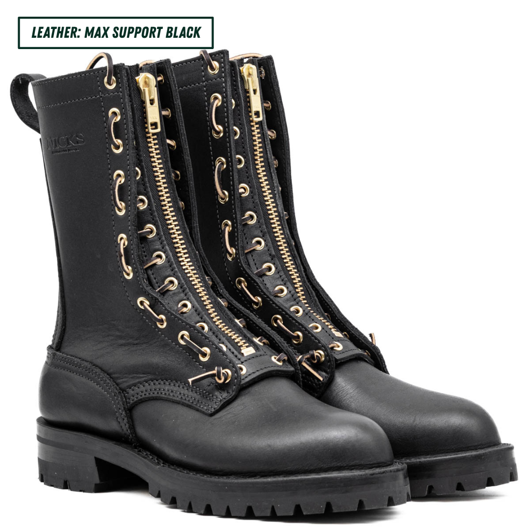 A pair of black leather lace-up combat boots with prominent gold-tone side zippers and matching gold eyelets, shown on a white background with a text label in the top left corner.