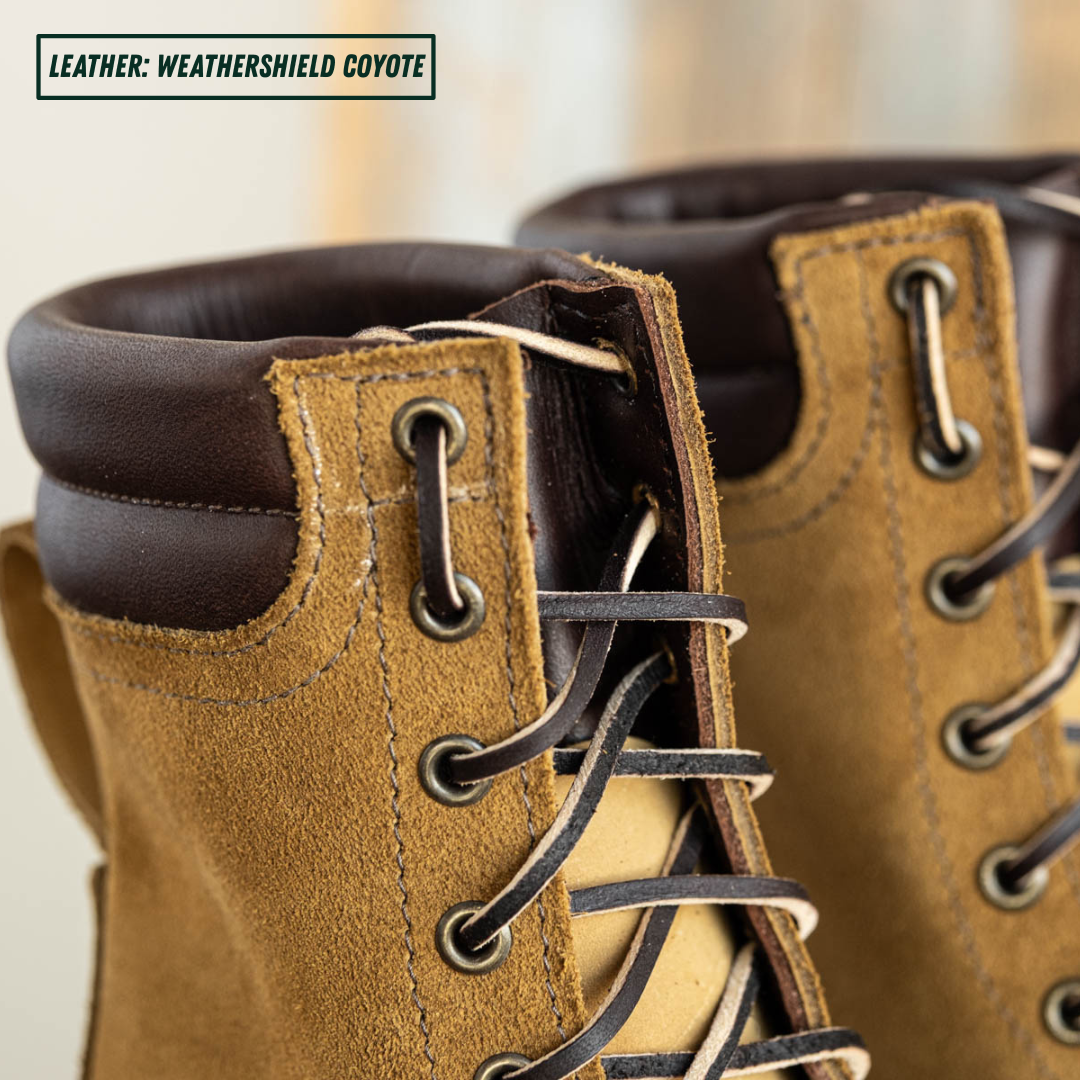 Close-up of a pair of lace-up boots in textured coyote brown leather, showing the laces, eyelets, collar, and interior lining. A small label in the top left reads 'LEATHER: WEATHERSHIELD COYOTE'.
