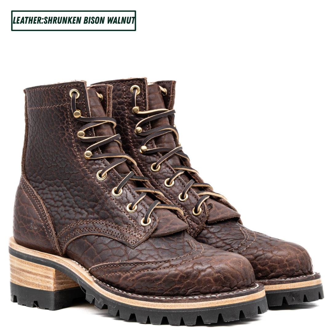 A pair of dark brown textured leather lace-up boots with a chunky layered wooden heel and black lug sole, shown on a white background with a text label in the top left corner.