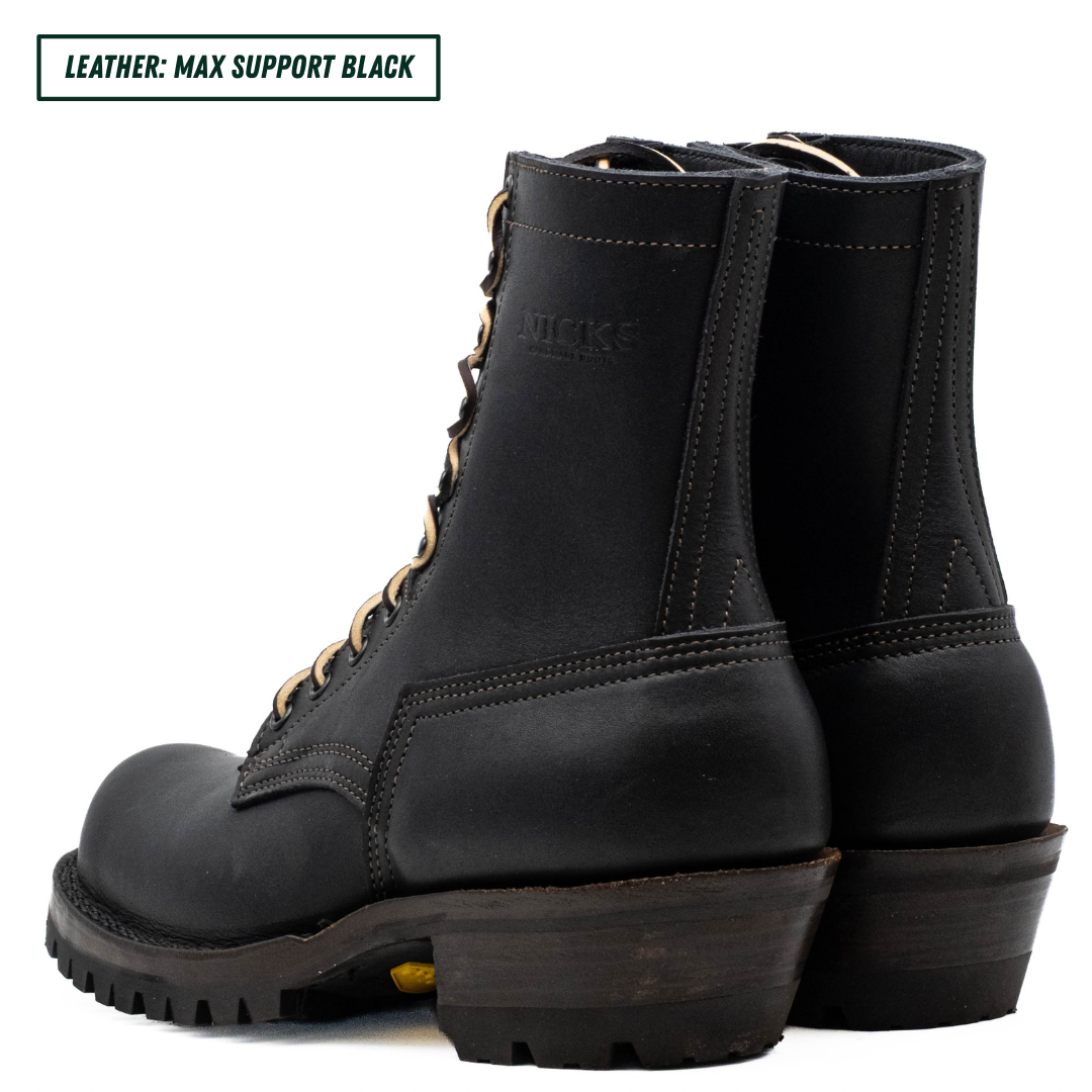 A pair of black leather lace-up ankle boots shown from the side and back on a white background, with a text label in the top-left corner reading 'LEATHER: MAX SUPPORT BLACK'.