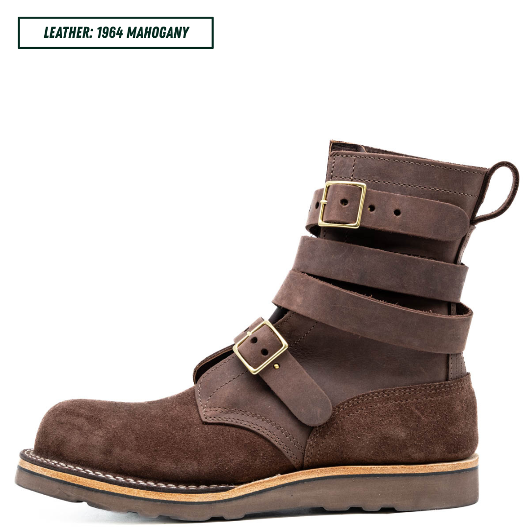 A dark brown leather ankle boot with multiple strap buckles, shown in profile against a white background. A text label in the top left reads 'LEATHER: 1964 MAHOGANY'.