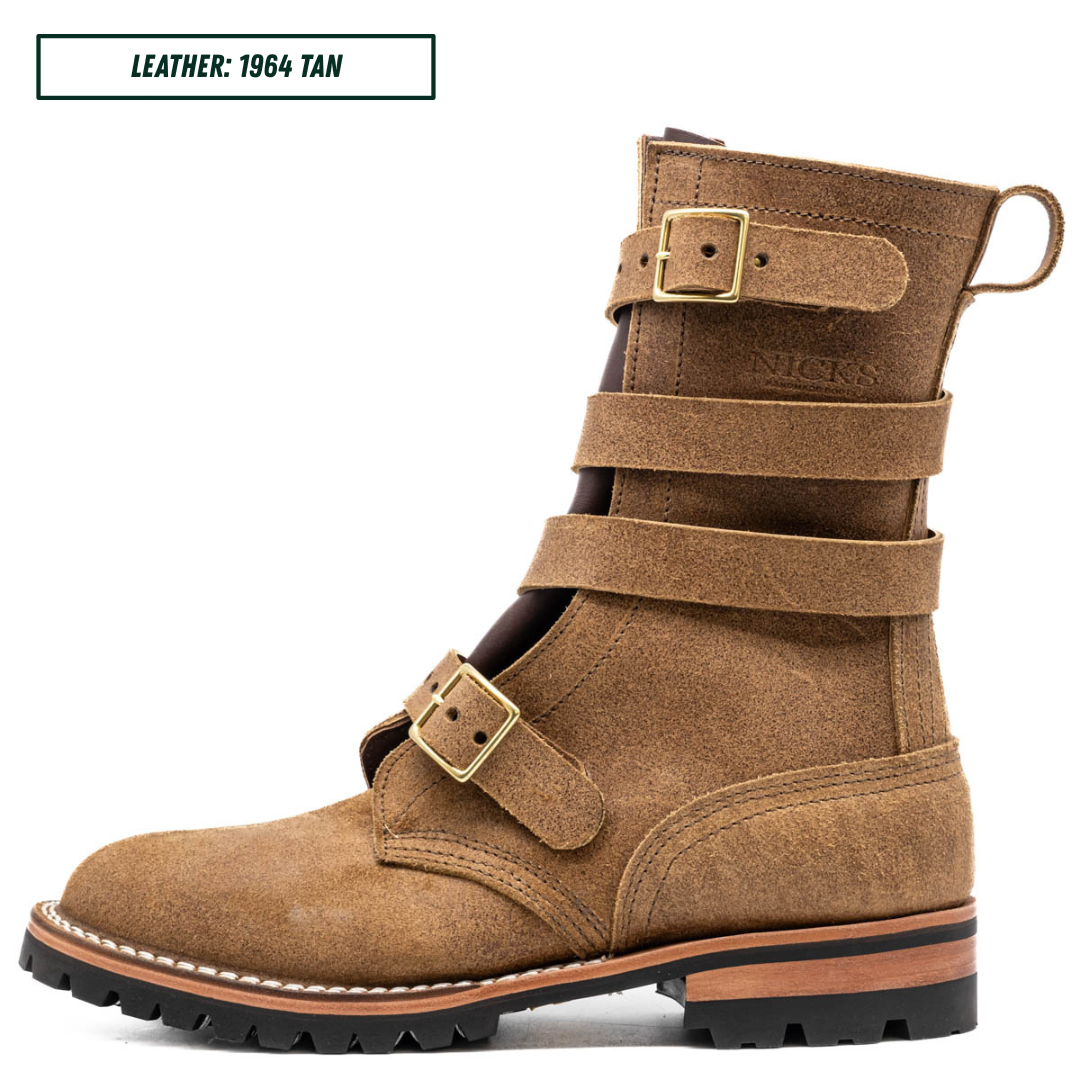 A single mid-calf leather boot in tan suede-like material with multiple wraparound straps and brass-tone buckle details, shown in side profile on a white background. A small label in the top left reads 'LEATHER: 1964 TAN'.