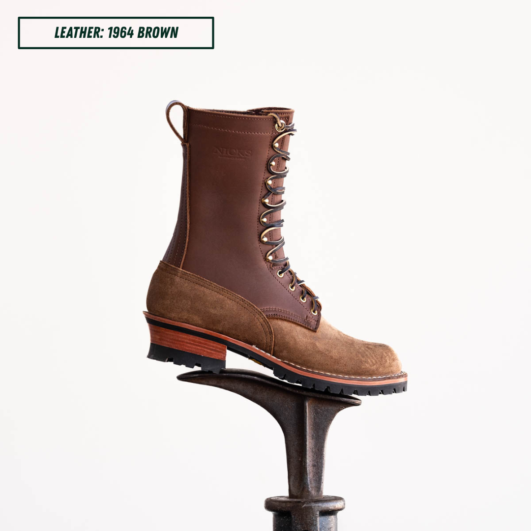 Brown leather boot sitting on boot jack in front of white background. Top left text reads 'LEATHER: 1964 BROWN'.