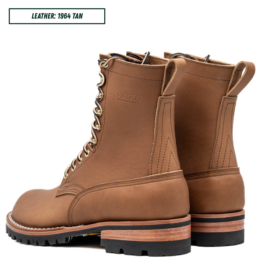 HD lace up build your own boots sitting together facing back left. Top reads 'LEATHER; 1964 TAN'.