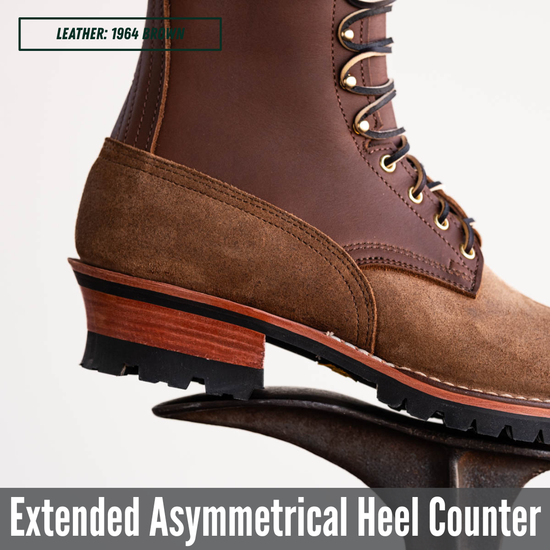 Close-up of a brown leather and suede lace-up boot showing the heel counter area, with text reading 'LEATHER: 1964 BROWN' and 'Extended Asymmetrical Heel Counter'.