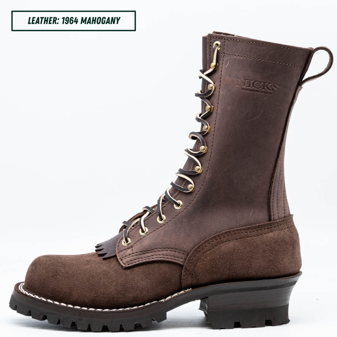 A dark brown leather lace-up boot shown in profile on a white background, with a text label in the top-left corner reading 'LEATHER: 1964 MAHOGANY'. The boot has gold-tone eyelets, a black sole, and the brand name 'NICKS' embossed on the side.