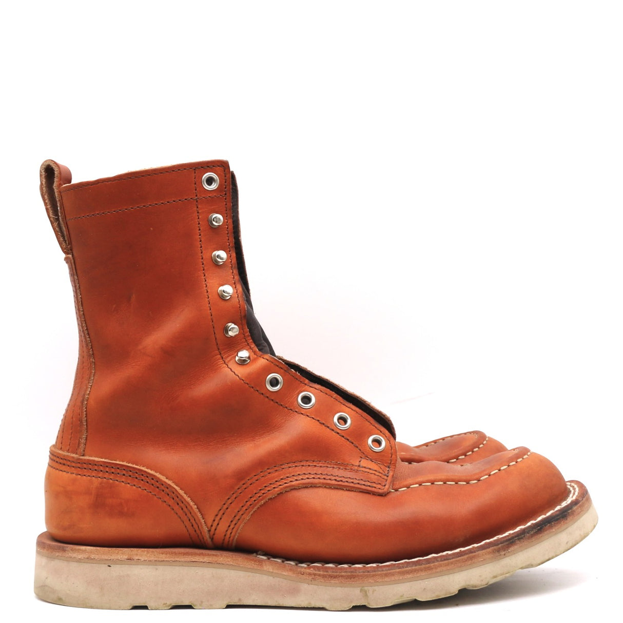 A single brown leather lace-up ankle boot with silver metal eyelets and a thick light-colored sole, shown from a side profile on a white background.