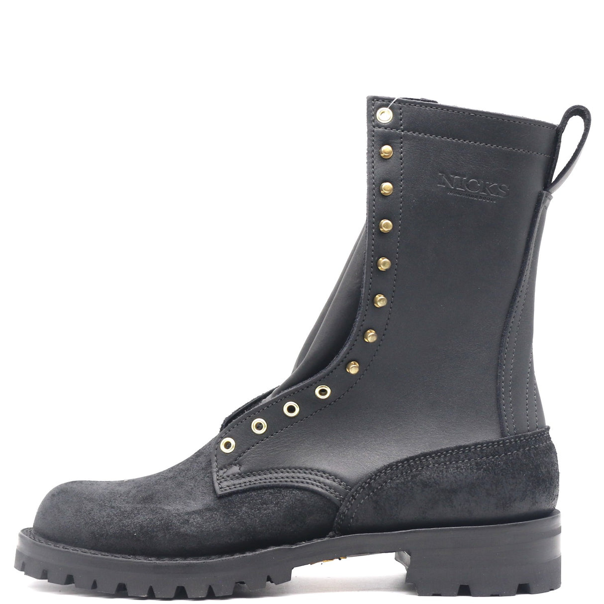 A black leather and suede ankle boot with gold-tone metal eyelets and studs, featuring a pull tab at the heel, shown against a plain white background.