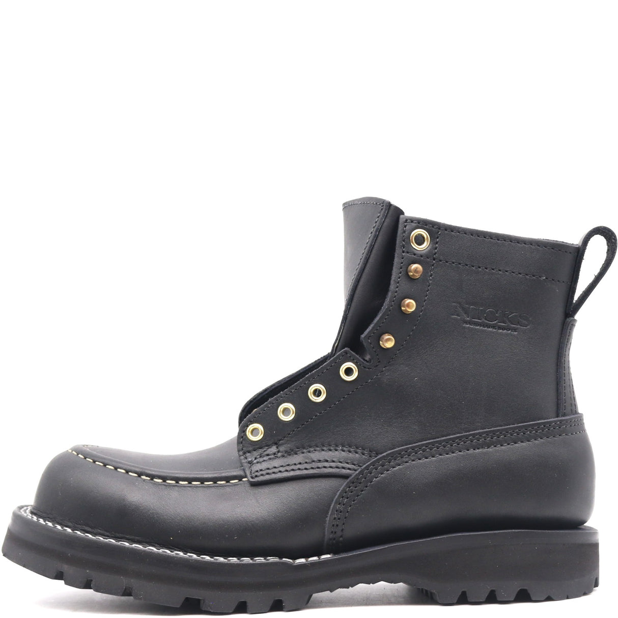 Black ankle boot with a moccasin toe, brass hardware, padded gusset, and comfort flex notches in front of a white background
