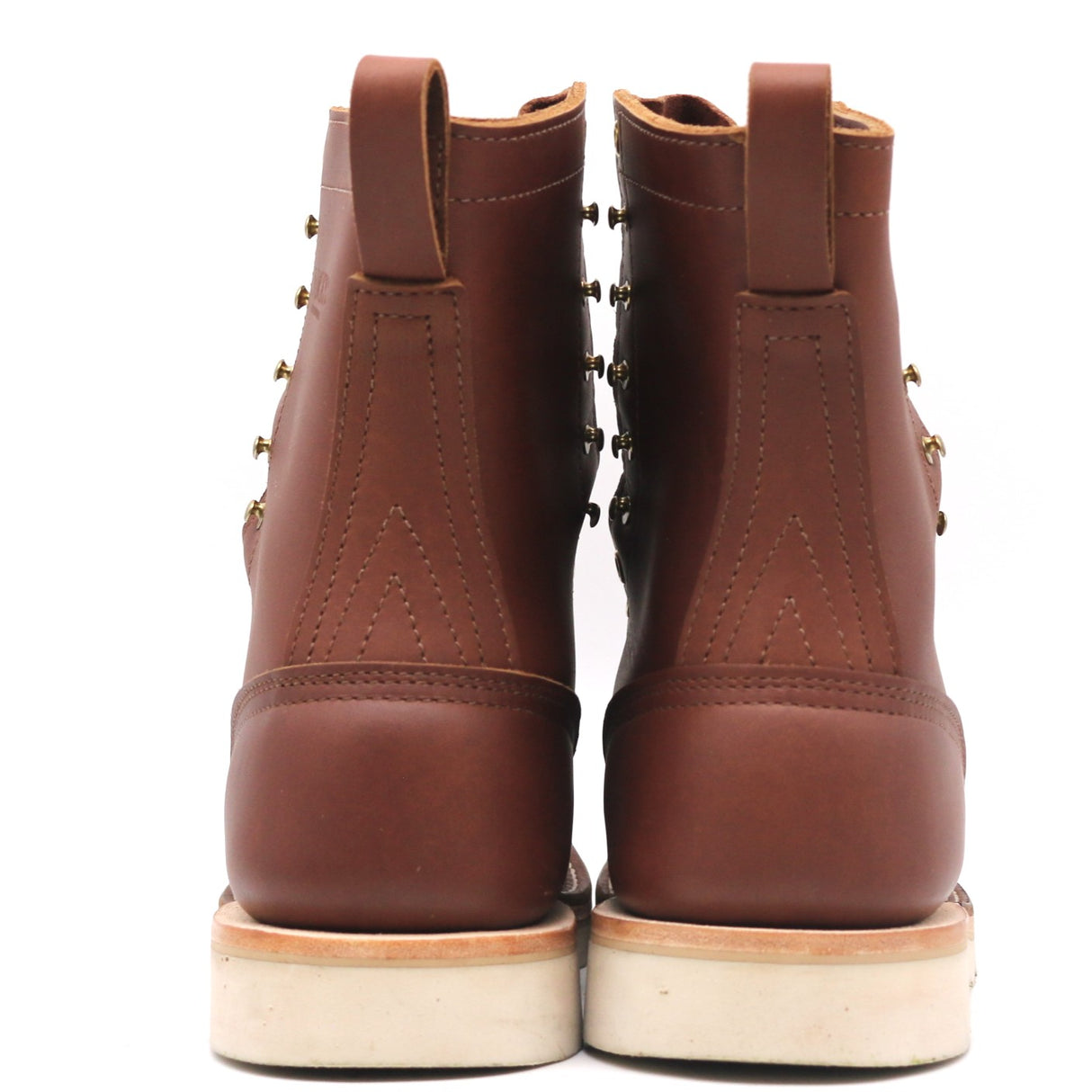 Pair of brown boots shown from behind. Photographs show heel counter, backstay, and pull loops. Boots show some light signs of wear.