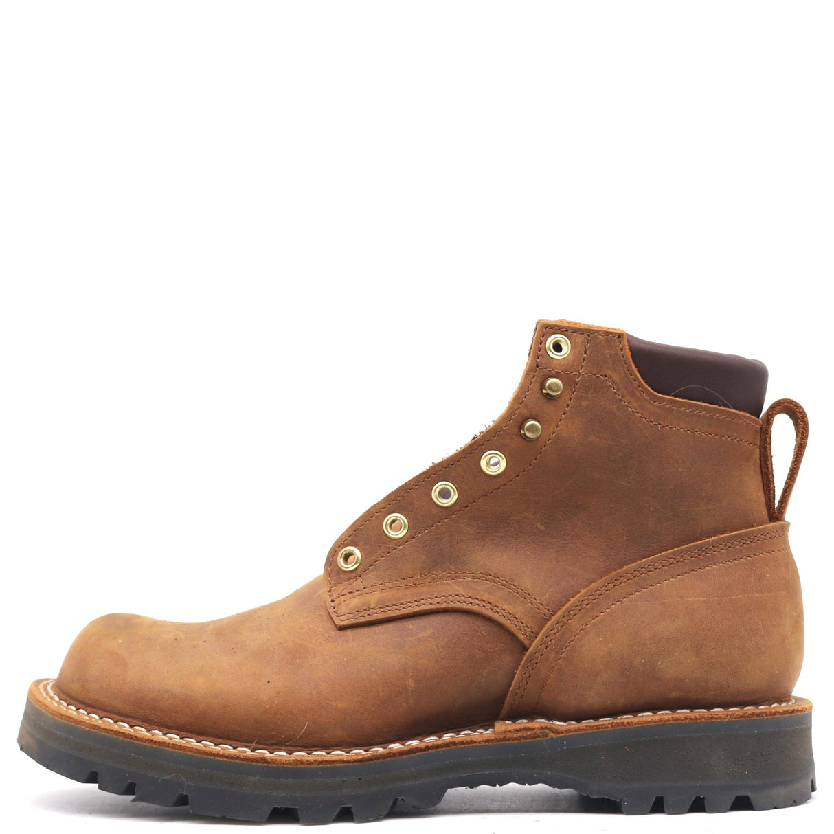 A brown leather lace-up ankle boot with brass eyelets, a pull tab, and a thick black lug sole, shown from a side profile on a white background.