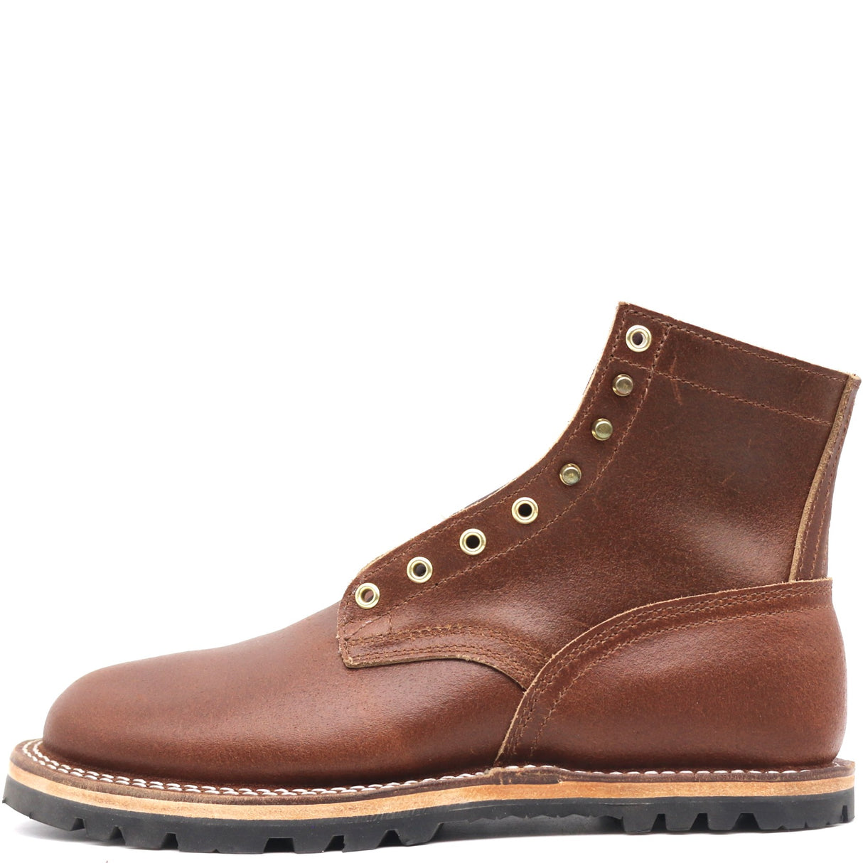 A single brown leather lace-up ankle boot with brass eyelets, a thick black lug sole, and contrast stitching, shown from a side profile on a white background.