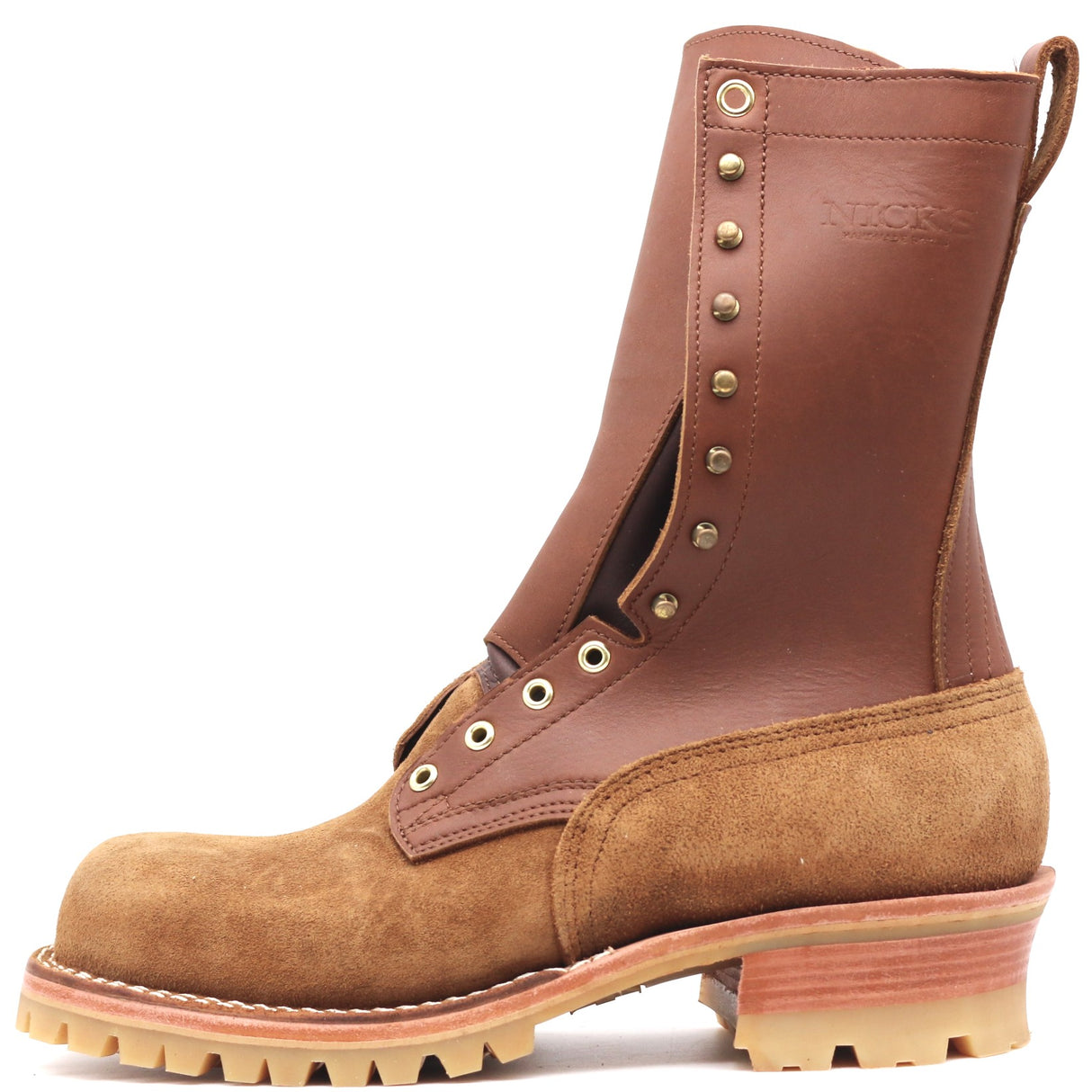 A tall brown leather and suede lace-up work boot with brass eyelets, a pull tab, and a chunky lug sole, shown on a plain white background.