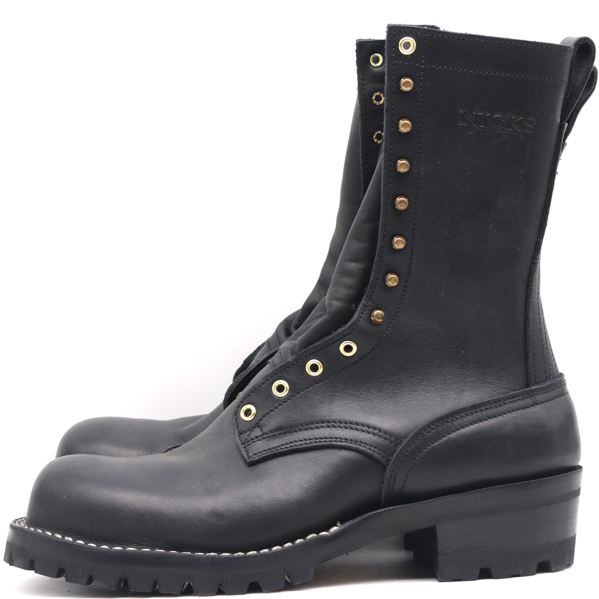 A pair of black leather lace-up boots with brass eyelets and studs, shown from a side profile view against a white background.
