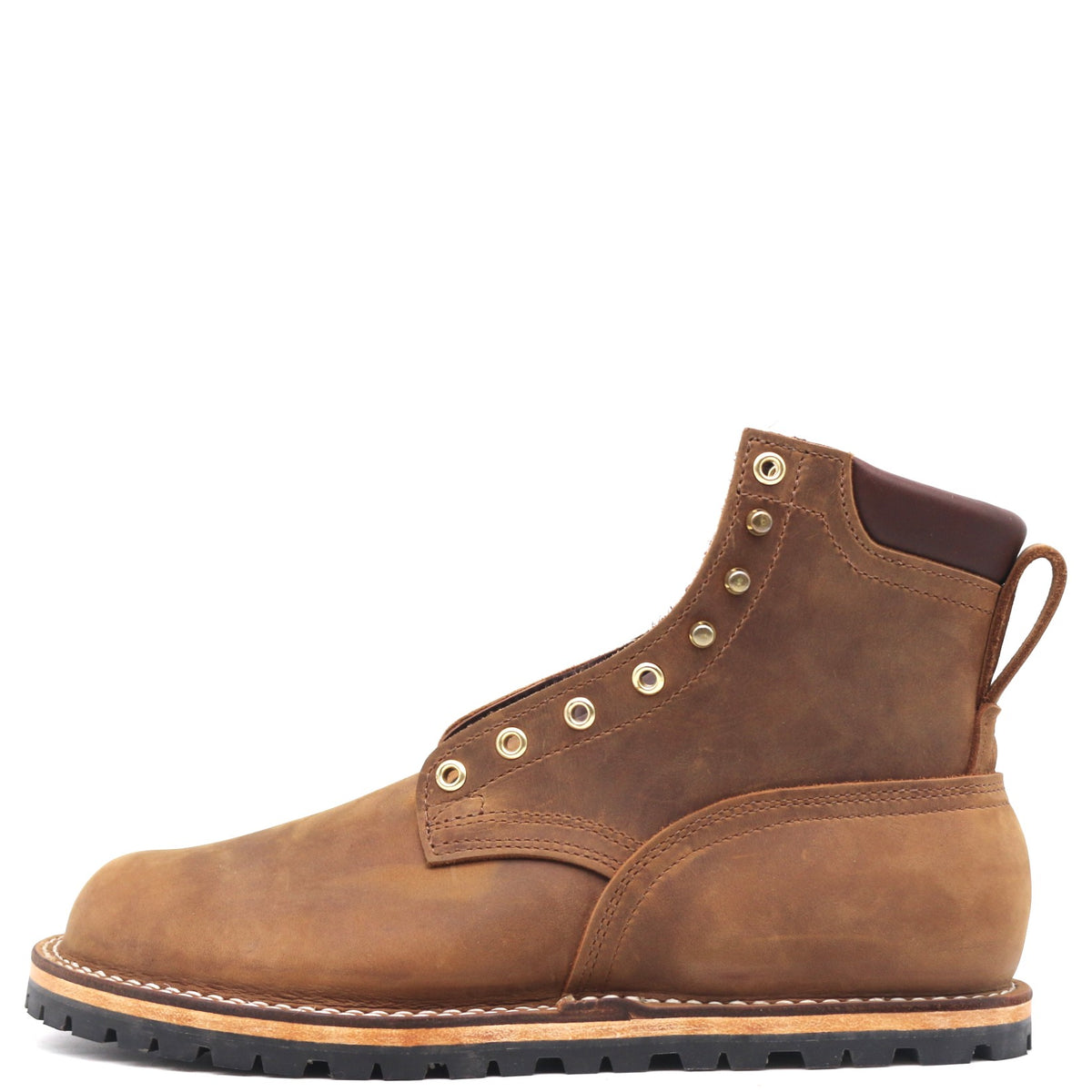 Brown zero drop flat boot with padded top and brass hardware in front of a white background.