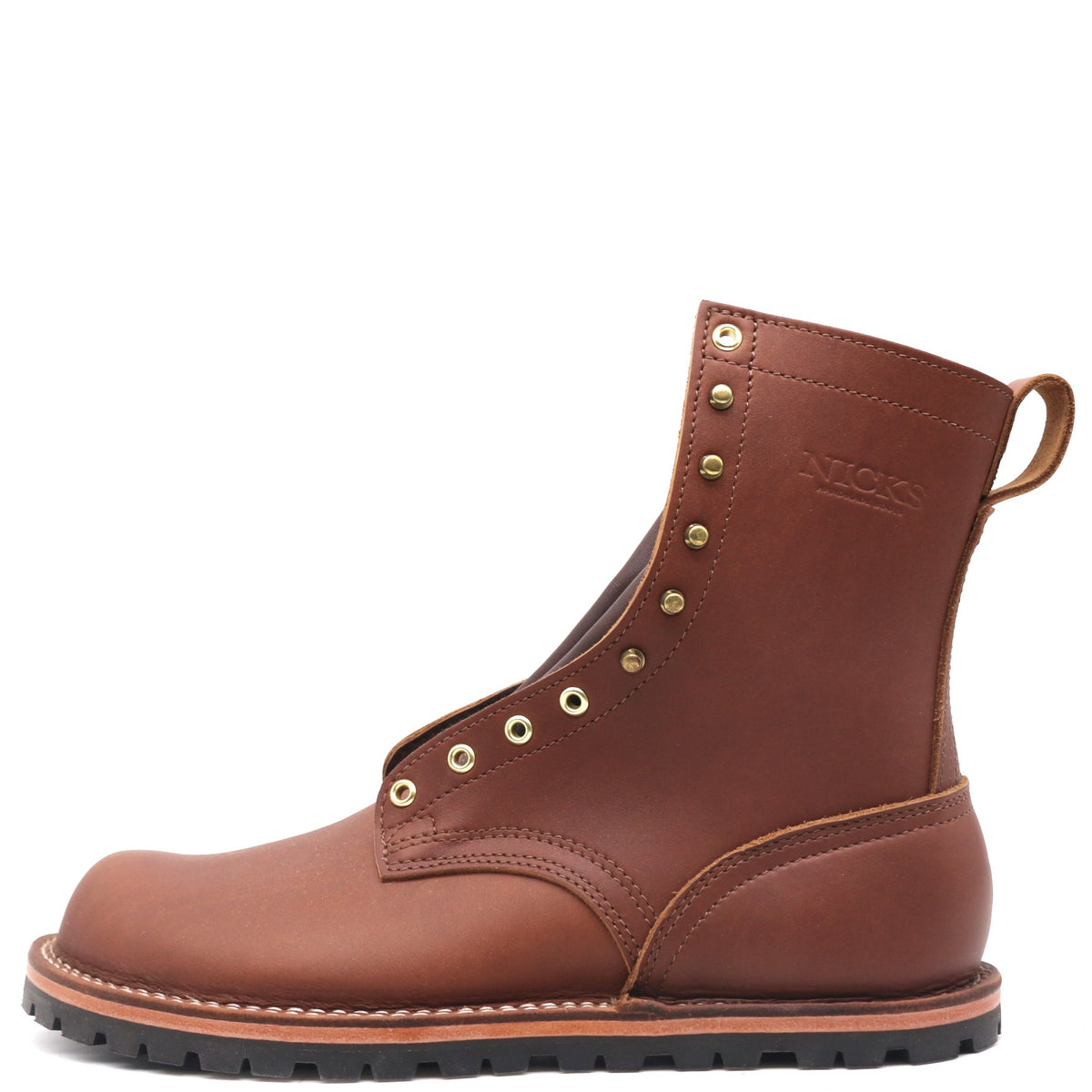Brown zero drop leather boot with brass hardware in front of a white background.