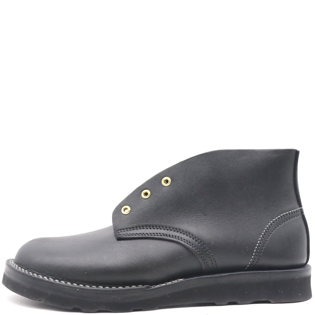 A black leather ankle boot with gold-tone metal eyelets and contrast stitching, shown from a side profile on a white background.