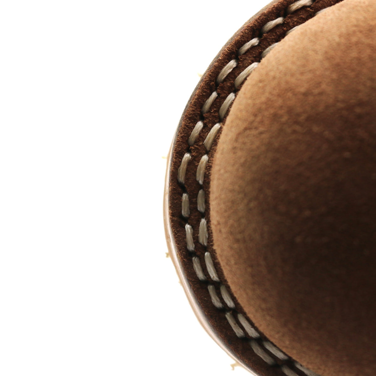 Close up of a leather boot toe showing the sanding around the outsole is a little closer to the sole stitching that normal.