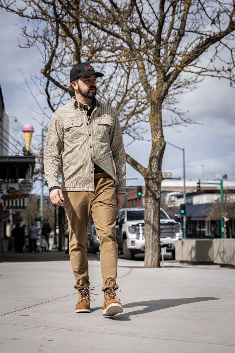 Aldert wedge sole boot in brown being worn for a walk in town
