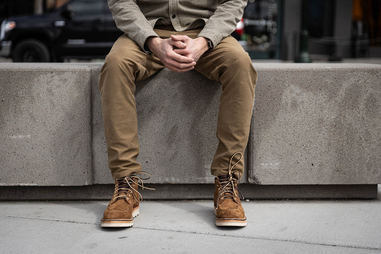 Aldert wedge sole boot in brown being worn for a walk in town