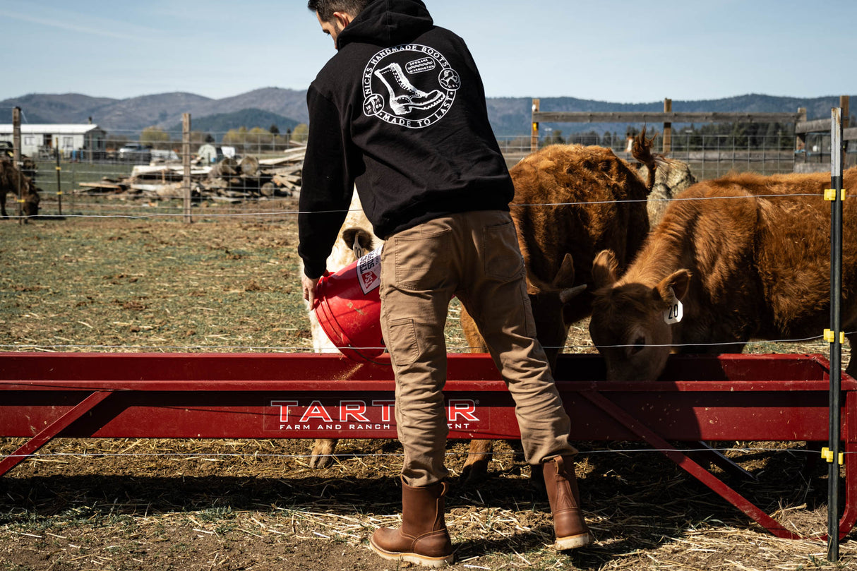 Brown chore boot being worn while doing chores around the farm