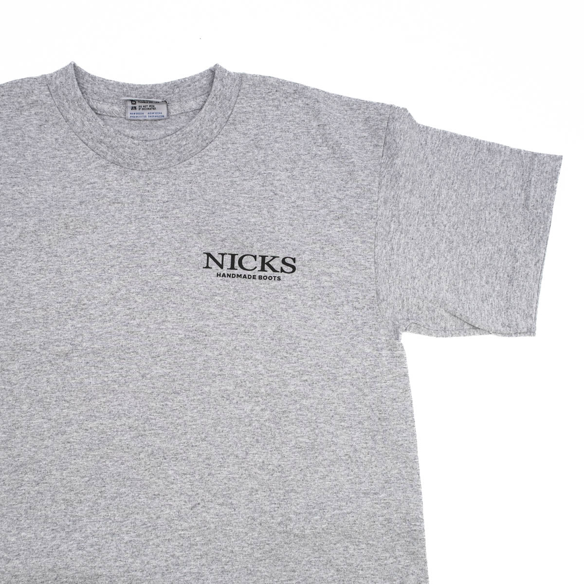 Grey T-shirt with a boot ad on it