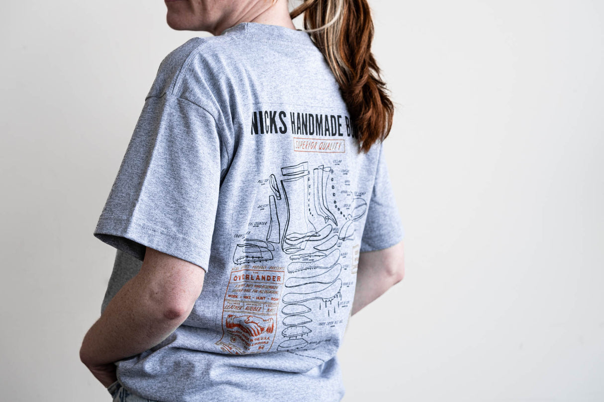 Grey T-shirt with a boot ad on it