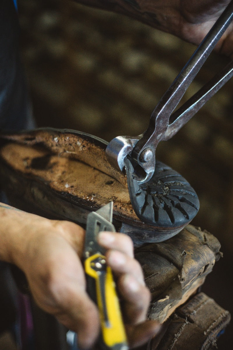 The midsole being prepped to be torn down for a resole or rebuild