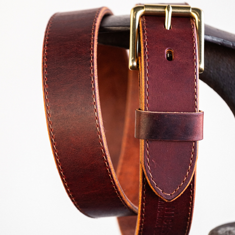 Zoomed in detail shot of buckle on Cypress Raisin Cherry Heritage belt