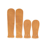 Tan Loggerl leather Kilties on a white background. 