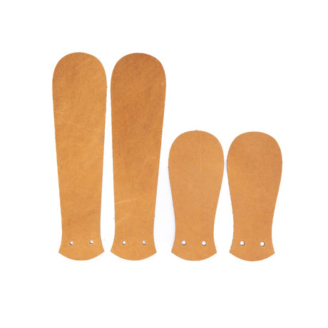 Tan Packer leather Kilties on a white background. 