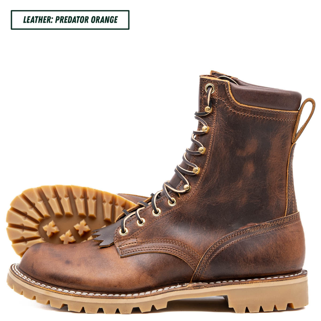 A pair of distressed brown leather lace-up boots with tan soles, shown on a white background with one boot standing upright and the other lying on its side to display the tread. A text label in the top left reads 'LEATHER: PREDATOR ORANGE'.