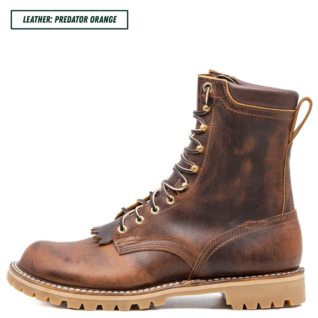 A single lace-up ankle boot in distressed brown leather with a tan lug sole, shown on a white background. A text label in the top left reads 'LEATHER: PREDATOR ORANGE'.