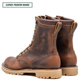 A pair of distressed brown leather lace-up boots with tan soles, shown from a three-quarter angle on a white background. A text label in the top-left corner reads 'LEATHER: PREDATOR ORANGE'.