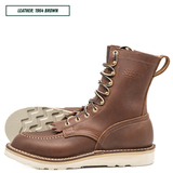 Moctoepro boots, one sitting side profile and the other laying down with outsole showing. Label on top left corner that reads "LEATHER: 1964 BROWN."