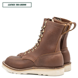 Moctoepro boots, both sitting together facing back left. Label on top left corner that reads "LEATHER: 1964 BROWN."