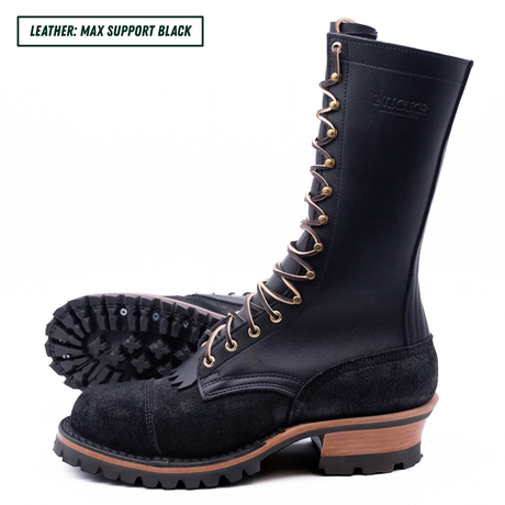 A tall black leather lace-up boot with a rugged sole, shown from the side with another boot placed behind it to display the tread. The text 'LEATHER: MAX SUPPORT BLACK' appears in the top-left corner.