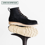 Short black boots, one is laying down on boot jack showing the outsole while the other is showing side profile sitting on top the other. Top left reads "LEATHER: MAX SUPPORT BLACK."