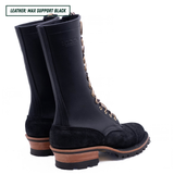 A pair of black leather lace-up boots with tan laces and brown stacked soles, shown on a white background with a text label in the top left corner.