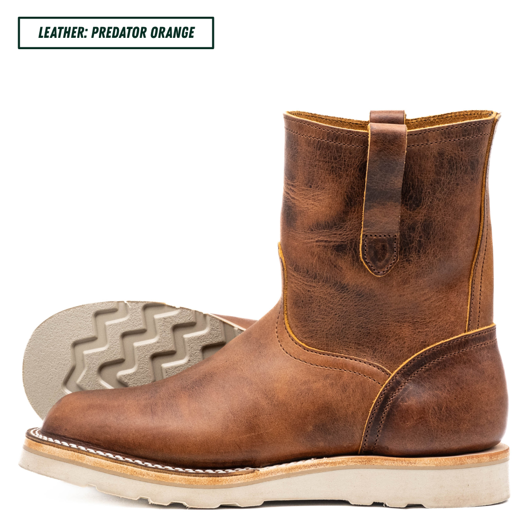A brown leather ankle boot shown in side profile on a white background, with a second boot turned to show the treaded outsole behind it. Text in the top left reads 'LEATHER: PREDATOR ORANGE'.