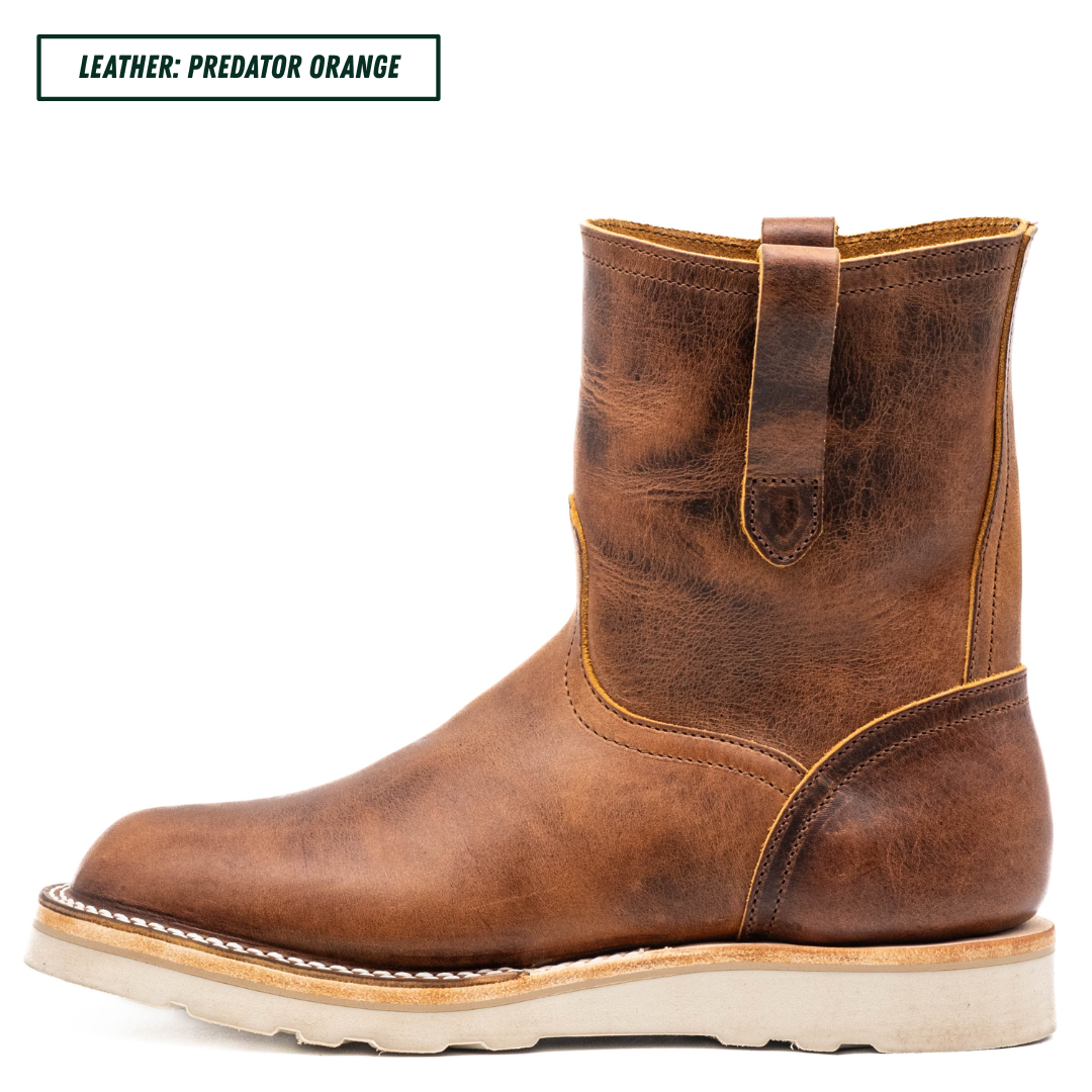 A single mid-calf leather boot in a distressed brownish-orange finish, shown in side profile on a white background. A text label in the top-left corner reads 'LEATHER: PREDATOR ORANGE'.